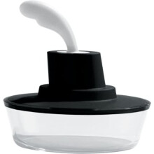 A Di Alessi Ship Shape Container with Small Spatula in 18/10 Stainless Steel and Thermoplastic Resin, Black