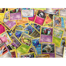 50 carte Pokemon assortite con foil olografici bonus