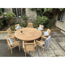 teak round table with 8 stacking chairs