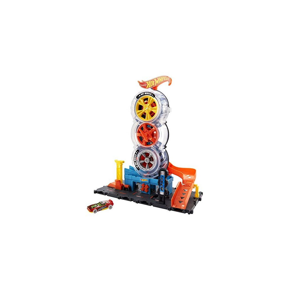 City Super Twist Tire Shop Playset, Spin the Key to Make Cars Travel Through the Tires, Includes 1 Hot Wheels Car, Gift for Kids 4 to 8 Years Old