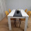 Wooden White Black Dining Table with 4 Mustard Stitched Leather Chairs 3