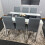Modern White and Black Wood Dining Table With 6 Grey Metal Chairs 5
