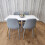Wooden Dining Table with 4 Grey Gem Patterned Chairs White Table 1