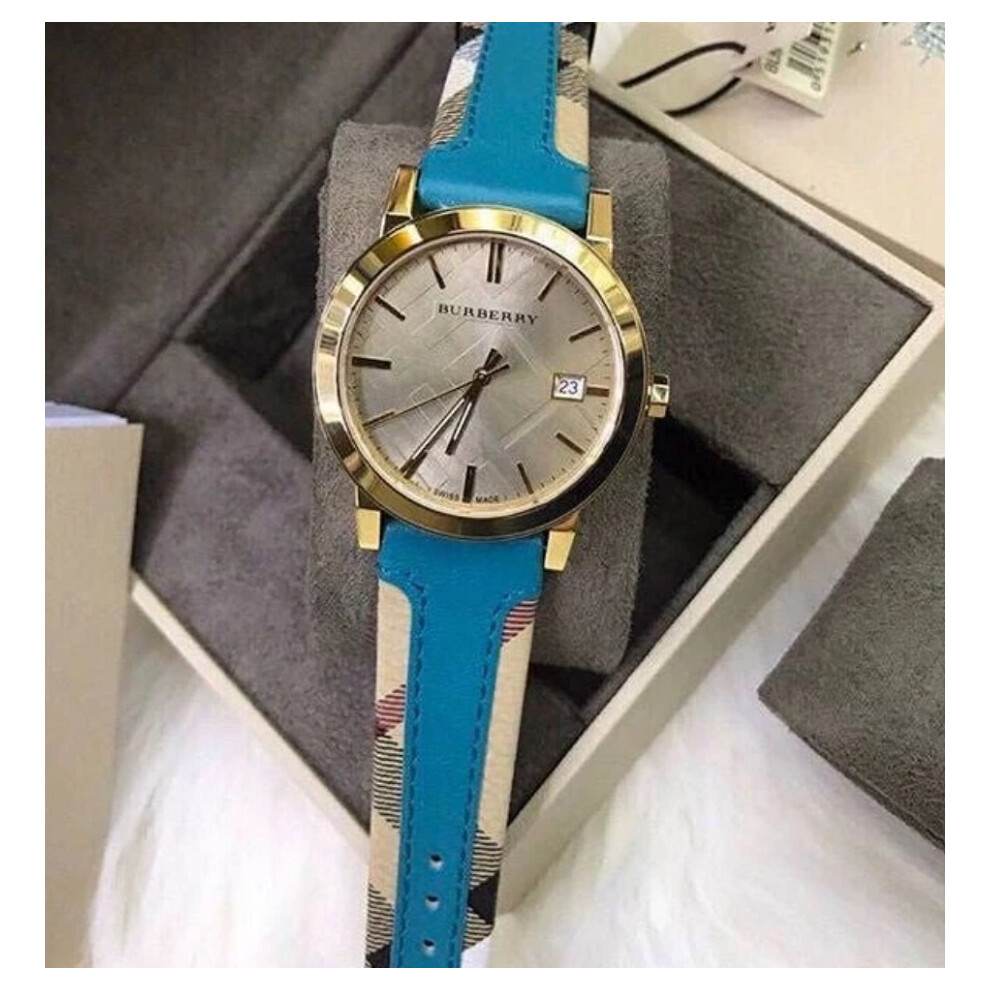 BURBERRY BU9112 WOMEN'S WATCH TURQUOISE STRAP GOLD DIAL GOLD CASE
