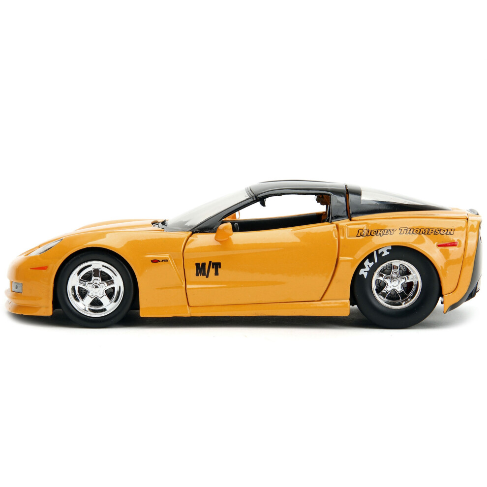 2006 Chevrolet Corvette Yellow with Black Top Mickey Thompson Bigtime Muscle Series 124 Diecast Model Car by Jada