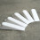 Alpina Set of 5 white plastic door stops, protects doors and floors 5