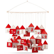Adventskalender mit 24 Häusern am Holzstab
