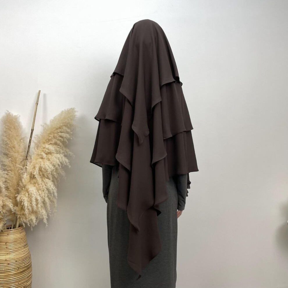 (coffee) Multicolor Fashionable Muslim Headscarves Wrap Around Hair, Neck, and Ears. Some Muslim Women Have A Preference for Religious Headscarves