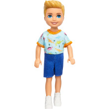 Poup  e Barbie Chelsea, petit gar  on, v  tue d'une combinaison amovible avec imprim   dinosaure et chaussures blanches, cheveux blonds et yeux bleus