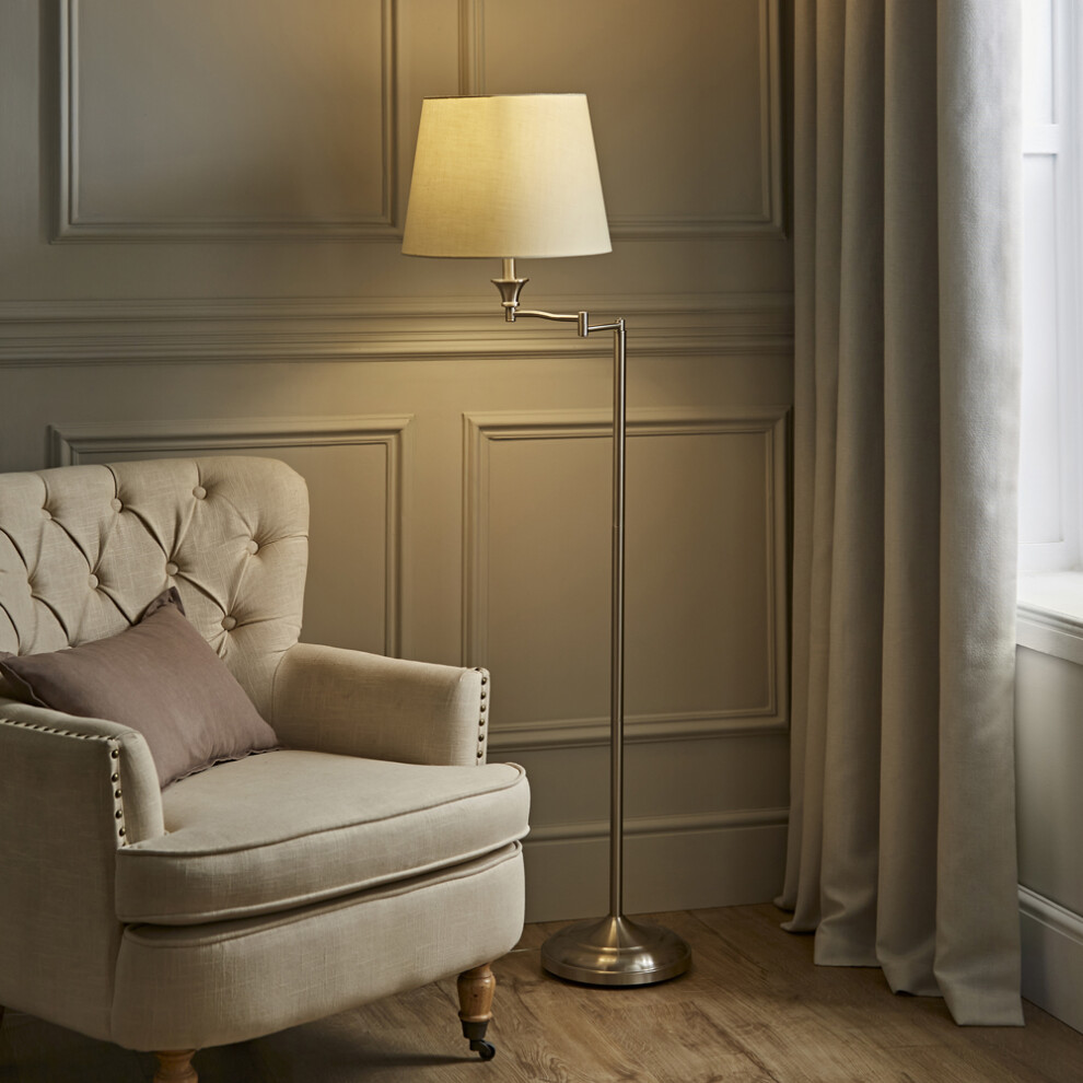 Modern Adjustable Swing Arm Floor Lamp in a Brushed Chrome Finish with a Beige Tapered Light Shade