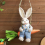Easter Straw Bunny Figurine, on Carrot Swing, A 6