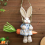Easter Straw Bunny Figurine, on Carrot Swing, A 7