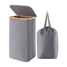 Cesta para la colada de 100 l con tapa, asas de bambú y bolsa extraíble.