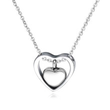 (plata) (plata) Un delicado contenedor de cenizas para mascotas en forma de corazón protege recuerdos