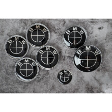 (Nero) Set completo di coprimozzi con stemmi per cofano bagagliaio BMW x7