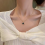 Collana con ciondolo a quadrifoglio bifacciale 2