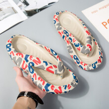(Khaki, 42-43) Men wear thick-soled flip-flops and women wear grafft-printed flip-flops on the outside