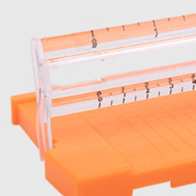 Orangener Papierschneider 120g Doppelskala 27  8,5  2,5 cm