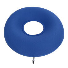 Cojín inflable azul en forma de dona para pacientes.