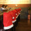 12er-Set rote Weihnachtsstuhlhussen mit Weihnachtsmütze 4
