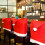 12er-Set rote Weihnachtsstuhlhussen mit Weihnachtsmütze 1