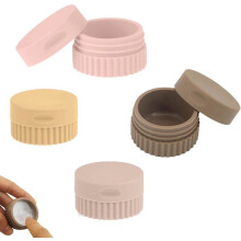 Colorful, leak-proof silicone travel jars for cream, lotion, and lip balm