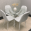 Round Glass Dining Table with 4 White Leather Kitchen Chairs 1