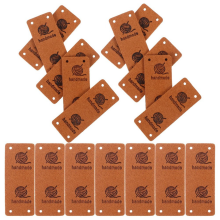 50 kpl keinonahkatarraa, käsintehtyjä, taittuvia reikiä sisältäviä tarroja
