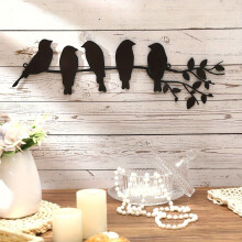 Décoration murale en métal avec des oiseaux sur des branches