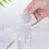 Refillable 100ml Clear PP Pump Dispenser Bottle with Dust Proof Lid 4