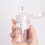 Refillable 100ml Clear PP Pump Dispenser Bottle with Dust Proof Lid 12