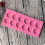 12-teilige silikonschokoladenform mit , rund, pink 9