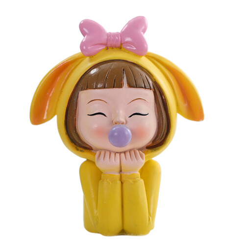 Une Statue De Gâteau Fille À Bulles Dessin Animé