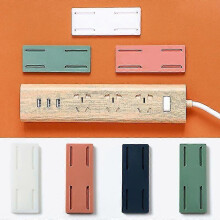 Self-adhesive wall mount for power strips and extension cords
