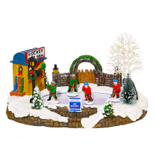 Weihnachtsbeleuchtetes Haus mit Musik und Eislaufen für Kinder,