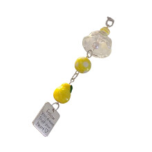 Accessoire de cloche porte-bonheur élégant pour sac d'appareil