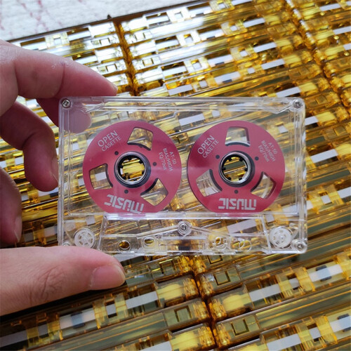 Premium Photo | Colored Audio Cassettes Hanging In The Air Against Purple - Foto 7