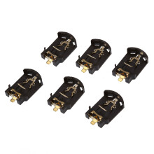 Conjunto de 6 suportes para baterias tipo botão CR2032 com carcaça de plástico marrom.