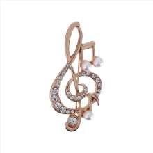 Broche elegante con forma de nota musical para mujer y niña, con cristales dorados y diamantes de imitación, 5,6 x 3 cm.