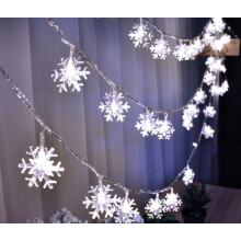 Luci decorative a stringa a forma di fiocco di neve, impermeabili e sicure, con luce verde calda, ideali per decorazioni interne ed esterne.