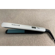 Piastra Remington Shine Therapy Advanced Ceramic con olio di argan marocchino per una lucentezza extra - S8500, nero/argento, 1 confezione