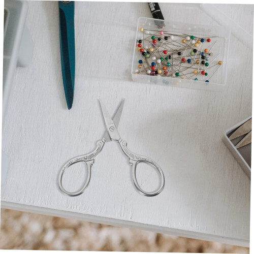 Small vintage snips with fine handle design for DIY projects at home and sewing shops. 1