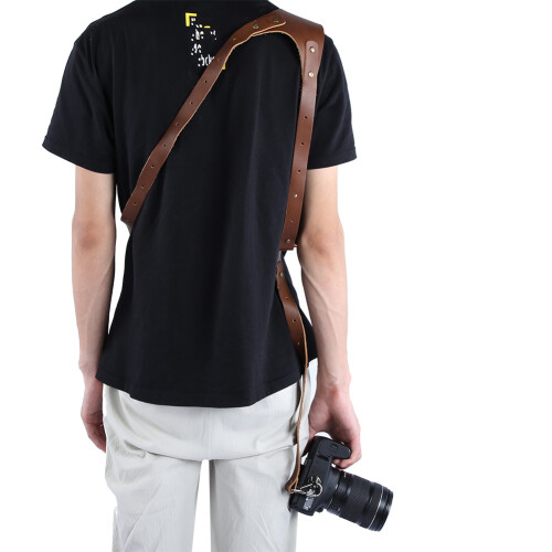Alça de couro para câmeras DSLR e mirrorless, ajustável com sistema de liberação rápida e compatível com tripé, confortável e prática. 2