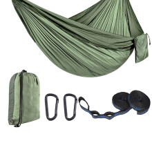 Camping hammock made of nylon, including tree straps and carrying bag, nylon texture, suitable for outdoor activities.