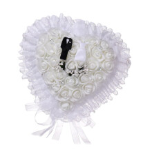 Elegant lace ring pillow for the wedding ceremony of the bride and groom.