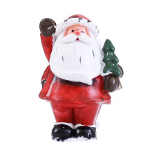 Estatuas clásicas de Papá Noel, vajilla de cerámica multicolor con adornos navideños hechos a mano para unas fiestas alegres.