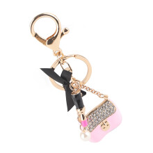 Sleutelhanger met elegant design, sleutelhanger van legering met strass-steentjes, prachtige schattige strik, handtasvormige hanger, glinsterende