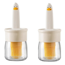 Kleine gelbe Enten-Ölflasche Ölpinsel und Flasche in einem Ideal zum Backen in der Küche