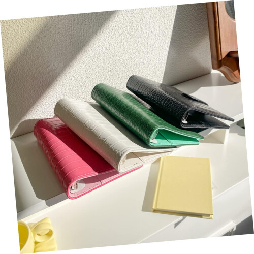 Textured binder with sturdy cover featuring card slots for notes and planning 1