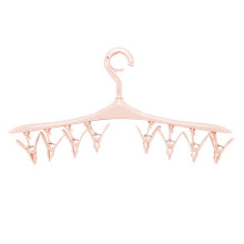 Colgador de ropa de plástico versátil, ecológico y no tóxico para un uso seguro, perfecto para colgar varias prendas a la vez.